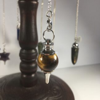 pendule œil de tigre jaune